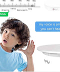 Child with curly hair listening closely near the Awesome Electric Turntable For Live Video Broadcasts with remote speed control.