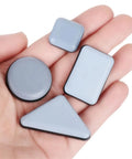 Heavy Duty Furniture Sliders Self Adhesive Floor Protectors Move Heavy Gear Without Breaking A Sweat 100 Pack in hand, various shapes, gray, smooth surface.