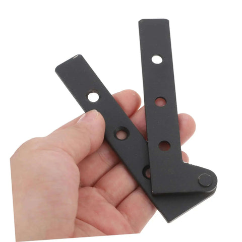 Hand holding two black metal pieces from Two Pack Heavy Duty Pivot Hinge Hidden Door Hardware For Secret Doors Easy Install Kit Built To Last Ideal For Cabinets And Home Use With Universal Compatibility And Sturdy Construction.