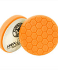 Orange pad from Hex-Logic Buffing Pad Kit 8-Piece 5.5 Inch Set for polishing cars, showing hex grooves for smooth finishes.
