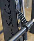 Close-up of the attachment mechanism on Pro Clubline Counter Balanced Smith Machine featuring heavy duty safety stops.