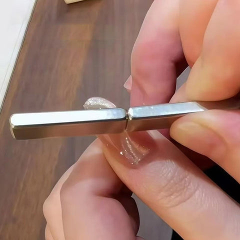 Hand holding nail magnet tool from Auto Weld Nails Set 600 Pieces Stainless Steel Fasteners For Dashboard And Headlight Panel Repairs