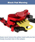 Red hydraulic disc brake caliper with yellow block pad warning for mountain bikes and e-bikes, front or rear mount