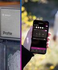 Front view of GE Profile Opal 2.0 Nugget Ice Maker in stainless steel beside a smartphone displaying WiFi app.