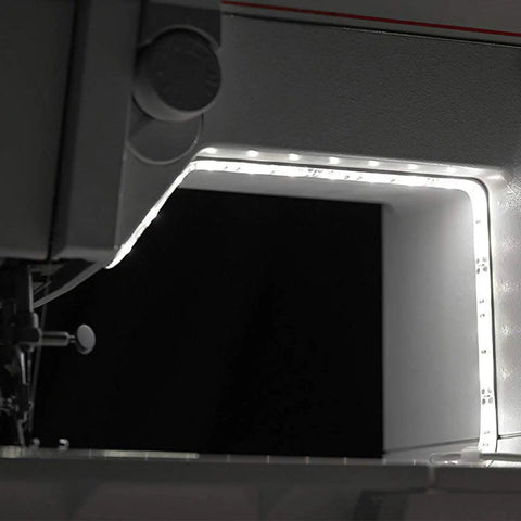 Slick 12 Inch Cut To Fit Led Light Strip With 18 Darn Bright Cool White Bulbs And Smart Touch Dimmer illuminating a sewing machine area.