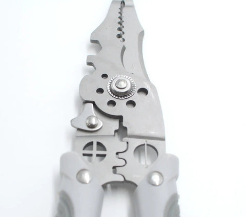 Close-up of 21 In 1 Wire Stripper And Multi Function Tool, 8.2 Inch silver steel cutter and crimper with rubber handle, top view.