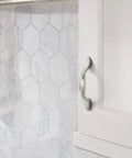 3 Inch Center To Center Satin Nickel Cabinet Pull Set 10 Pack installed on white cabinet with hexagonal tile backsplash