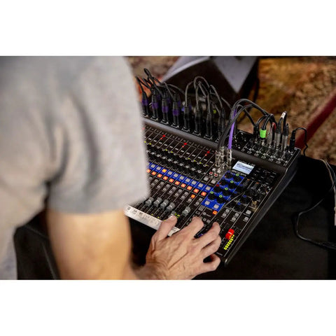 Person using LiveTrak L-20 Mixer And Multitrack Recorder For Musicians With 20 Inputs And 22 Tracks At 24-Bit 96kHz during live session