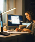 Desk Lamp With 10W Wireless Charger And USB Port, Clock LCD Display, Dope All In One Charging Station on a study desk in a home office.