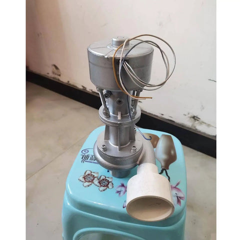 Grab And Go Portable Micro Hydro Generator 500W 110V for home use, lightweight silver water turbine, visible on a stool.