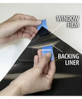 Hands peeling NA05 Window Film For Daytime Privacy And Sun Control Extra Dark Natural Black 5 Very Dark 24 Inch By 14 Feet