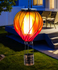 Colorful Solar Hot Air Balloon Lantern With Realistic Flickering Flame For Outdoor Waterproof Hanging Light For Patio Porch Yard Garden Decor Eco Friendly Solar Powered Garden Decor Lighting For Nighttime Vibe Ambience And Easy Dusk To Dawn Operation hanging near patio at night