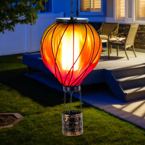 Colorful Solar Hot Air Balloon Lantern With Realistic Flickering Flame For Outdoor Waterproof Hanging Light For Patio Porch Yard Garden Decor Eco Friendly Solar Powered Garden Decor Lighting For Nighttime Vibe Ambience And Easy Dusk To Dawn Operation hanging near patio at night