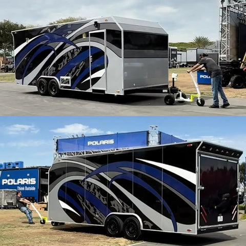Monster Tug Off-Road Trailer Dolly moves a large gray and blue trailer with ease on flat ground during setup.
