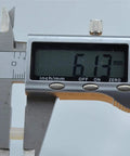Caliper measuring 6.13 mm showing precision for Premium White Nylon Hex Standoff Spacers Pack Of 100.
