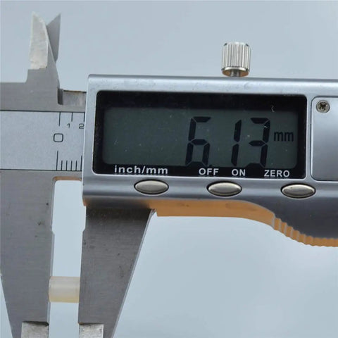Caliper measuring 6.13 mm showing precision for Premium White Nylon Hex Standoff Spacers Pack Of 100.
