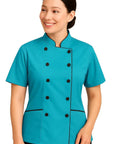 Pro Level Short Sleeve Tailored Fit Chef Jacket For Women Smooth Turquoise Double Breasted Kitchen Uniform on model smiling, short sleeves.