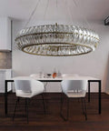 Sleek Modern Crystal Chandelier Ceiling Light With Adjustable Gold Pendant Ring Featuring Quick Setup Eight Bulb Glass Halo Fixture To Level Up Kitchen Dining Decor above a dining table.