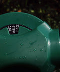 Green hose end sprayer dial close-up with water droplets, part of Select N Spray No Pre Mix Hose End Sprayer With Adjustable Rate Dial.