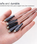 Hand holding 10Pcs Piezoelectric Igniter Kit With Copper Cap Wires For Gas Fireplaces Water Heaters And Stoves for quick DIY repair.