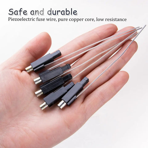 Hand holding 10Pcs Piezoelectric Igniter Kit With Copper Cap Wires For Gas Fireplaces Water Heaters And Stoves for quick DIY repair.