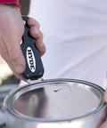 Person using Dual Blade Folding Painter Tool Five In One Stainless Steel Multi Tool With Flexible Putty Knife Opens Cans