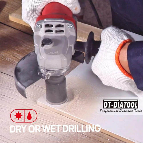 DT-DIATOOL diamond core drill on tile surface; gray/red drill with guard, gloved hands