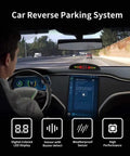 Driver in car using Wireless Parking Sensor System With 4 Blue Backup Sensors, LED Distance Display, And Sound Warnings installed.