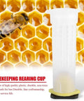 Beekeeping Rearing Cup Kit For Queen Bee Roller Cage With Plastic Gear For Insects Tools 20 Pack Easy To Use Lightweight Cage Cup Holder And Cell Fixtures, shown on honeycomb background with bee.
