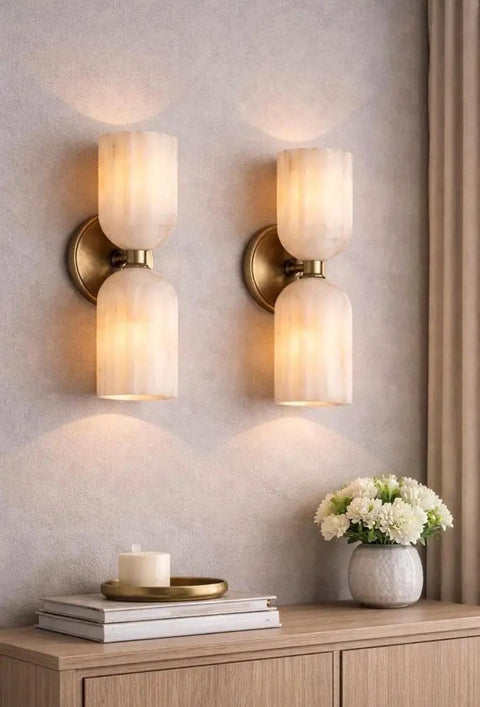 GLEAMING NEST Modern Alabaster Wall Sconce, Double Light Fixture, Antique Brass Finish, Fluted Stone Shades, Contemporary Wall Lamp for Bedroom, Living Room & Hallway, Brushed Chrome on textured wall.