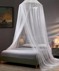Mosquito Net Bed Canopy for Kids and Adults, White Dome Ceiling Hung Mesh Tent, installed over a bed in a modern room.