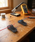 2 Pcs Hands Free Electric Wire Welding Fixture Portable Soldering Jig Tool Helping Hands Clamps holding wires on a workbench.