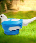 Heavy Duty Pigeon Injection Holder With Thickened Carrier securing a pigeon on grass