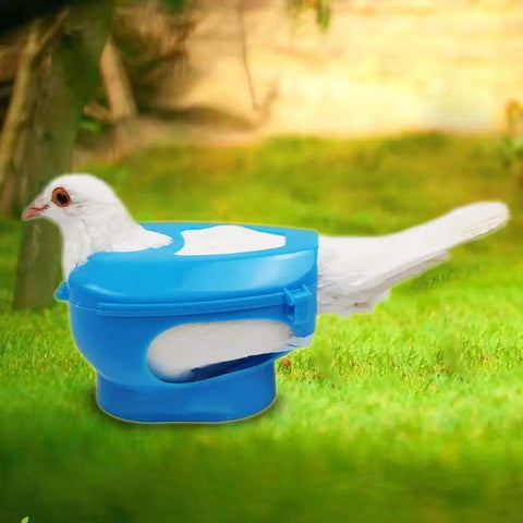 Heavy Duty Pigeon Injection Holder With Thickened Carrier securing a pigeon on grass