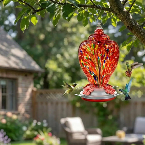 Colorful Hand Blown Glass Hummingbird Feeder For Outdoors Patio Large 32 Ounce With Ant Moat Hanging Hook Rope Cleaning Brush And Service Card Red Firework in tree