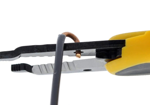 Close-up of Kinetic Reflex T-Stripper 45-915 Wire Stripper for 10-20 AWG with wire being stripped, yellow handle visible.