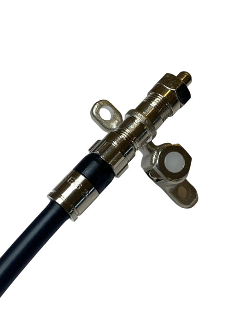 Close-up of Coax Cable End Terminator Caps 75 Ohm F Type for unused splitter port, metal construction, attached to cable.