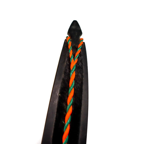 Close-up of calf hair recurve bow limb with orange and green string for Calf Hair Recurve Bow Limb Dampeners 2 Pack For Quiet Release And Smoother Shots Peel And Stick Paddings For Archery Enthusiasts And Target Practice Everyday.