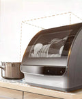 Freestanding Countertop Dishwasher With Auto Dry Storage And Snappy Touch Controls For Rapid Cleaning Cycles high Temp Sterilization And Smart Power Savings on kitchen counter.