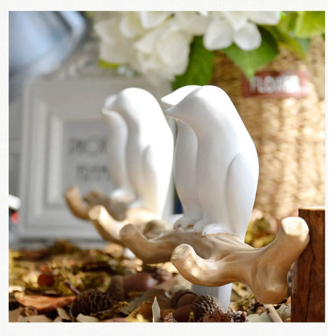 Slick Wall Mounted Hooks For Coats Keys Hats And Towels Housing A Rad Bird Motif, white ceramic birds perched on decorative hook.