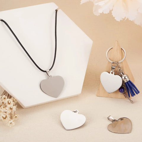 Front view: silver 33mm heart-shaped stainless steel pendant with a snap-on bail for DIY necklaces and earrings.