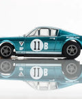 Shelby GT350R 1965 Donohue White Blue Slot Car With High Performance Traction Magnets Precision Balanced Chassis Realistic Tires For Smooth Fast Racing Great For Collectors And Competitive Play