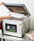 Pro Grade Chamber Vacuum Sealer Packs A Solid Punch With Sturdy 16 Inch Seal Bar And Whisper Quiet Motor. User places cutting board inside.
