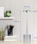 Cordless LED Table Lamp With Rechargeable 6000mAh Battery And Two Level Brightness Go To Modern Silver Finish next to books and clock