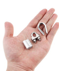 Hand holding components from Beefy Heavy Duty Eighteen Piece Three Sixteenth Inch Wire Rope Accessory Kit With Six M5 Cable Clips, Six Stainless Steel Thimbles, And Six Aluminum Crimping Loop Sleeves For DIY Rigging, Marine, And Outdoor Projects