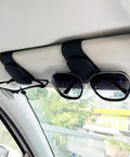 Keep Your Ride Looking Sharp With This Two Pack Magnetic Sunglass Holder Upgrading Leather Visor Clip securely holds sunglasses.