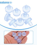 Pack Of Eight Clear Glass Table Bumpers With Solid Stems And Grippy Non Slip Bottoms That Slide Right Into Quarter Inch Holes on a hand.