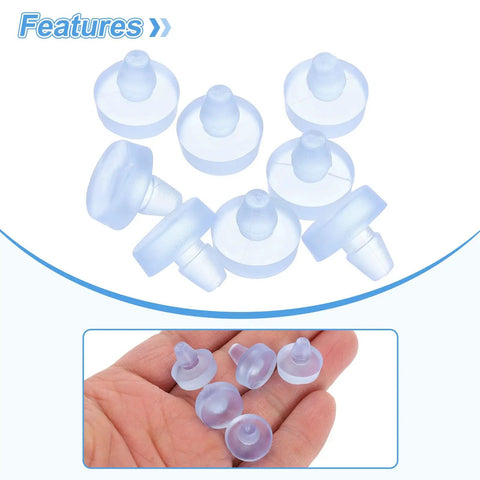 Pack Of Eight Clear Glass Table Bumpers With Solid Stems And Grippy Non Slip Bottoms That Slide Right Into Quarter Inch Holes on a hand.
