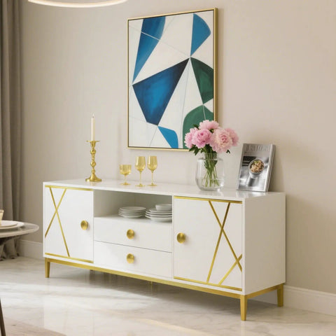 Modern sideboard with gold accents beneath geometric artwork, styled with pink flowers and gold accessories on top.
