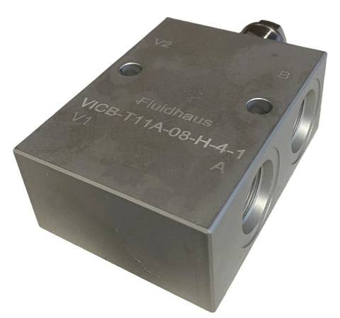 Inline hydraulic counterbalance load-holding valve block with four SAE-8 ports, gray metal body.